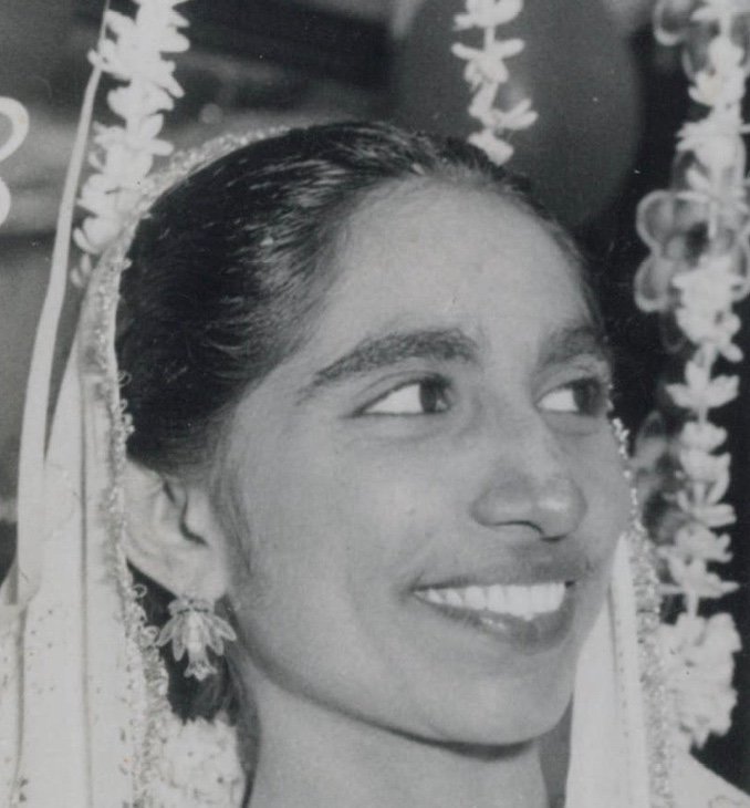 Roshan H. K. Abdulla, Dr. Abdulla&rsquo;s mother, smiling in her wedding garland