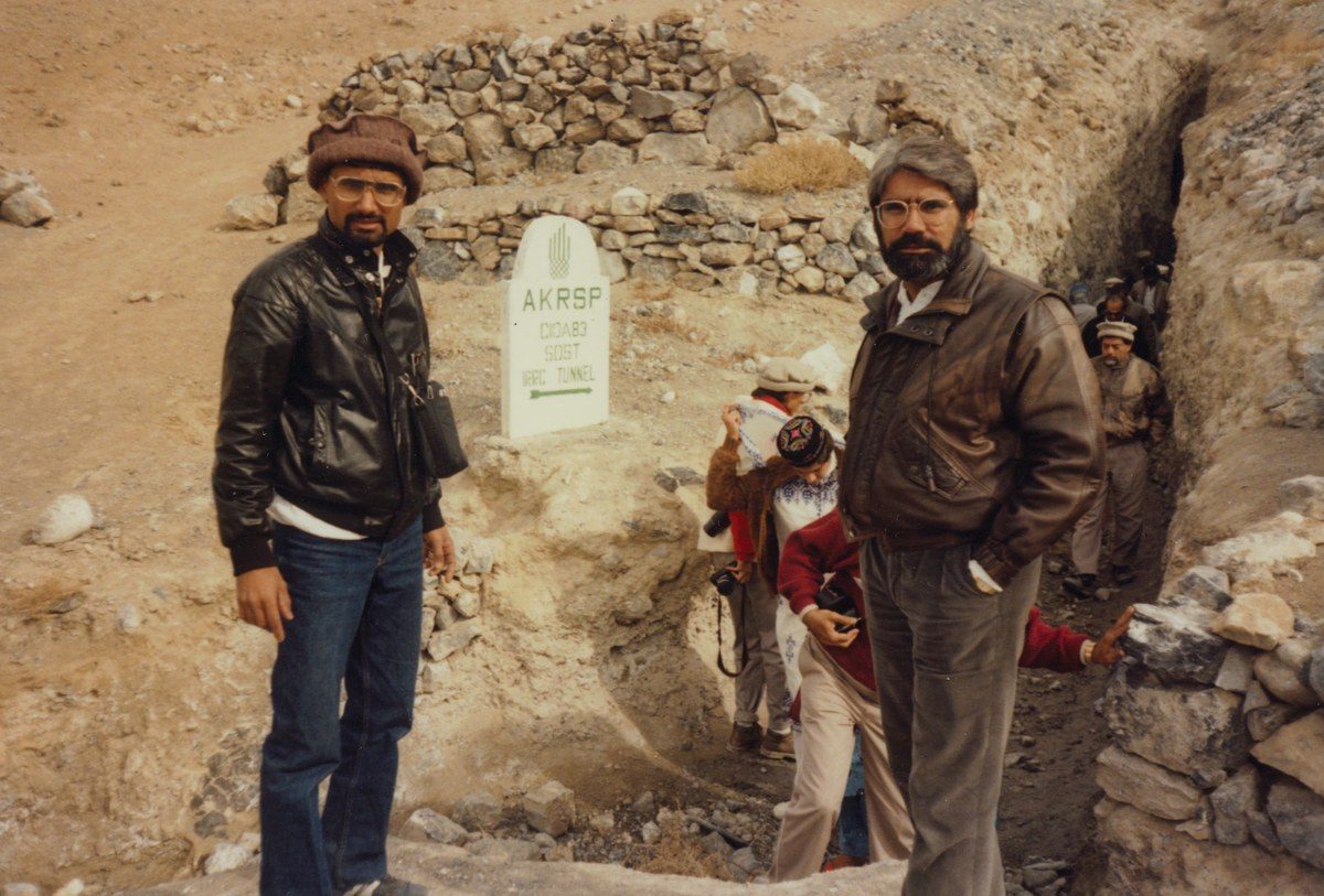 Dr. Abdulla, beard grown for the trip, at an AKRSP irrigation tunnel marker, Sost, Gilgit&ndash;Hunza, Pakistan, 1989
