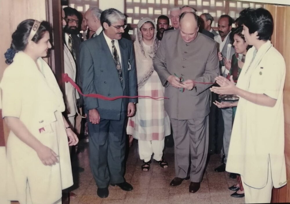 His Highness the Aga Khan cutting the ribbon to open the Angiography Suite, with Dr. Abdulla standing beside him