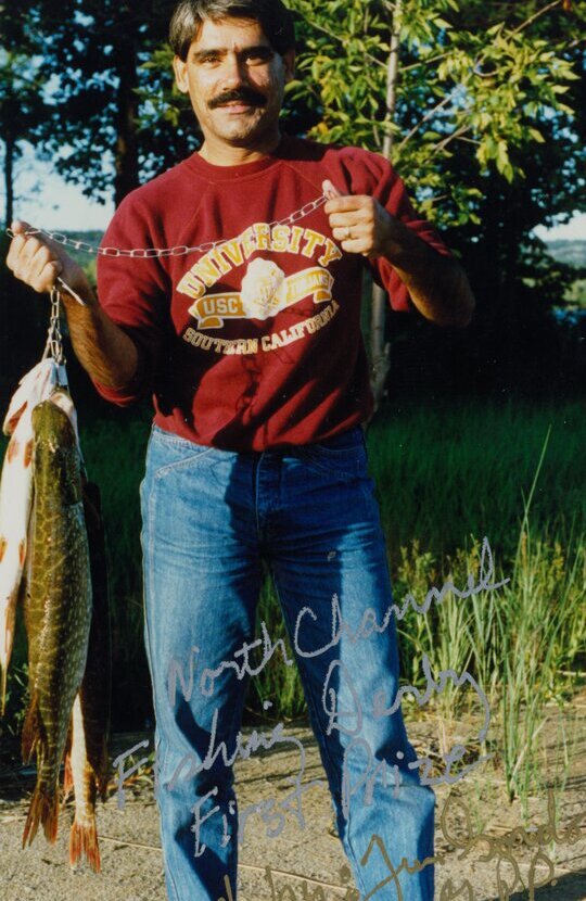 Dr. Abdulla fishing for pike and trout on a Canadian lake