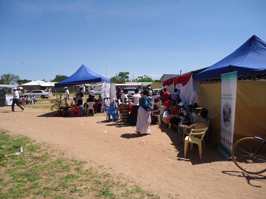 Community members lined up for free health screening at the Joining Hands Initiative camp, Bariadi, Tanzania