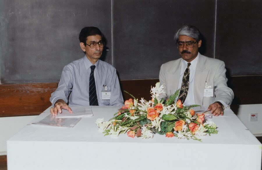Dr. Abdulla seated on an academic panel at the Aga Khan University with Professor Camer Vellani