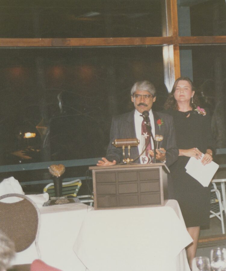 Dr. Abdulla speaking at the podium before presenting the inaugural Dr. Abdulla Award to Patrick O'Sullivan