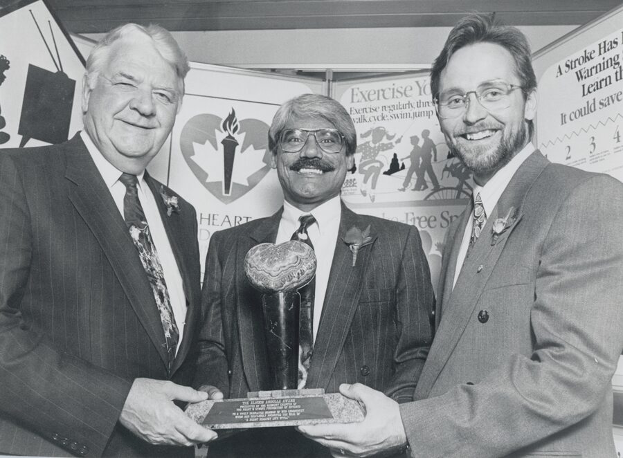 Dr. Abdulla presenting the first Dr. Abdulla Award to Patrick O'Sullivan, with Dr. Paul Field, the cardiac surgeon who performed the first coronary bypass operation in Canada